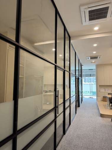 The Esper Healthcare office, glass-partitioned rooms along a bright corridor