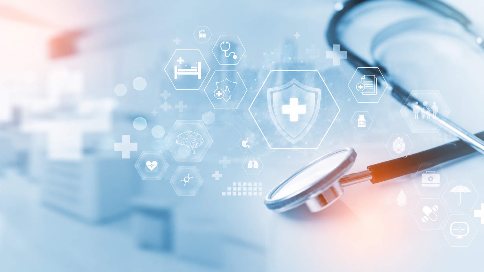 A stethoscope beside a digital healthcare interface of medical icons